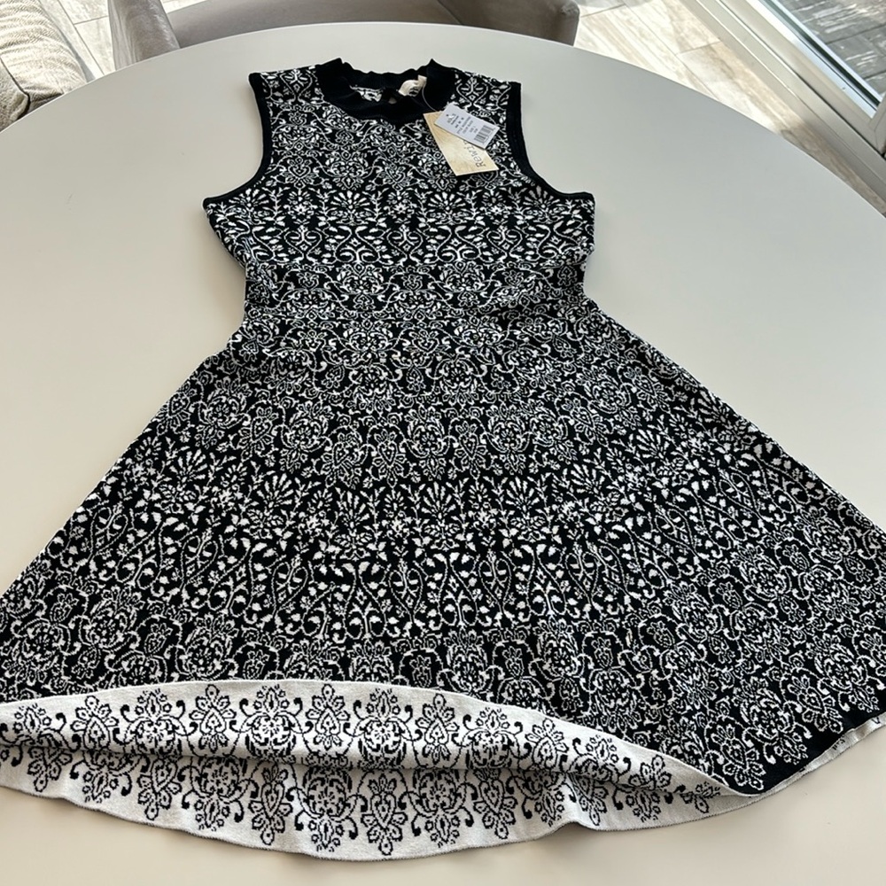 Patterned black and white sleeveless dress with A-line